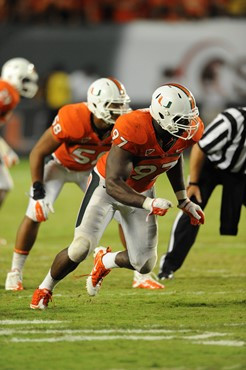 University of Miami Hurricanes defensive lineman Adewale Ojomo #97 plays in a game against the Ohio State Buckeyes at Sun Life Stadium on September...