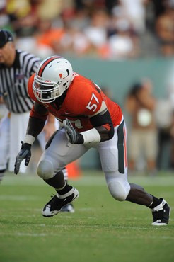 University of Miami Hurricanes defensive lineman Allen Bailey #57 rushes in a game against the University of Central Florida Knights at Dolphin...