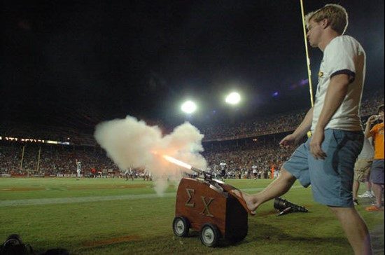 University of Miami Epsilon Chi Students fire a cannon after the Hurricanes score in a game against the Texas A&M Aggies at the Orange Bowl on...