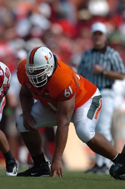 University of Miami offensive lineman Joel Figueroa #61 gets set to block in a game against the North Carolina State Wolfpack at the Orange Bowl on...