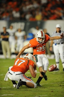 University of Miami kicker/punter Matt Bosher adds the extra point in a game against the Georgia Tech Yellow Jackets at Land Shark Stadium on...