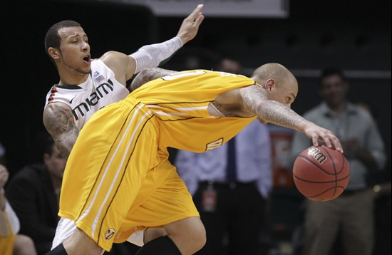 Valparaiso's Richie Edwards, front, drives around Miami's Trey McKinney Jones during the second half. (AP Photo/J Pat Carter)