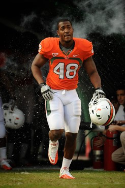University of Miami Hurricanes defensive lineman Andrew Smith #48 plays in a game against the Boston College Eagles at Sun Life Stadium on November...