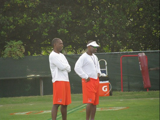 Head coach Randy Shannon (l) alongside strength & conditioning coach Andreu Swasey (r) Sunday on the Greentree Practice Fields.