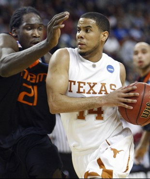 Texas guard D.J. Augustin works the ball around Dwayne Collins in the first half. (AP Photo/Sue Ogrocki)