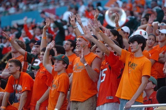 University of Miami Hurricane fans hold up their hands indicating the start of the fourth quarter in a game against the University of Central Florida...