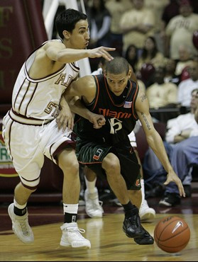 Miami's Denis Clemente, right, dribbles past Florida State's Josue Soto during the second half of a college basketball game, Saturday, Jan. 20, 2007,...