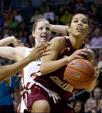 Miami's Stefanie Yderstrom, left, reacts after she knocked the ball away from Boston College's Kat Cooper during the second half of an NCAA women's...