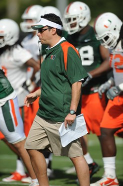University of Miami Offensive Coordinator/Quarterbacks Coach, Jedd Fisch, instructs the team on how he wants them to execute his game plan during a...