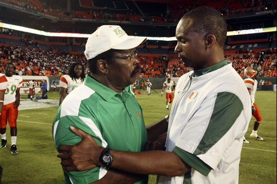 Florida A&M head coach Joe Taylor, left, and Miami head coach Randy Shannon congratulate each other at the end of an NCAA college football game,...