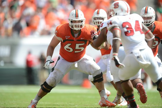 University of Miami Hurricanes offensive lineman Brandon Linder #65 and the Canes take on the North Carolina State Wolfpack at Sun Life Stadium on...