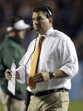 Miami coach Al Golden watches from the sidelines during the first half of an NCAA college football game against North Carolina in Chapel Hill, N.C.,...