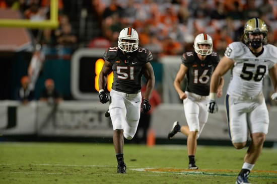University of Miami Hurricanes linebacker Juwon Young #51 plays in a game against The Pittsburgh Panthers at Sun Life Stadium on November 29, 2014. ...