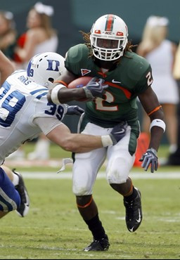 Miami running back Graig Cooper (2) avoids Duke linebacker Adam Banks during the second quarter of an NCAAcollege football game in Miami, Saturday,...