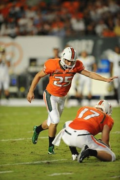 University of Miami Hurricanes kicker/punter Matt Bosher #25 kicks in a game against the Georgia Tech Yellow Jackets at Land Shark Stadium on...