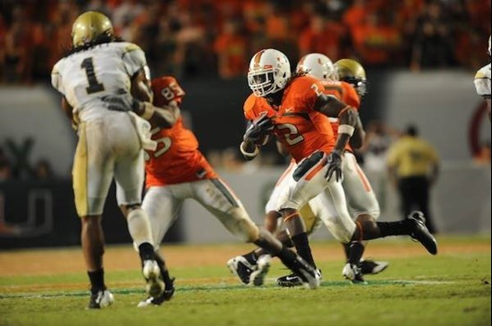 University of Miami Hurricanes running back Graig Cooper #2 carries the ball in a game against the Georgia Tech Yellow Jackets at Land Shark Stadium...