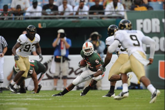 University of Miami Hurricanes running back Javarris James #5 carries the ball against the Deamon Deacons of Wake Forest at Dolphin Stadium on October...