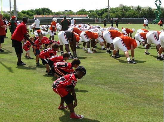 The Kendall Hammocks stretch with the Mimai Football Team during training camp