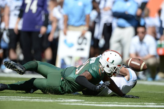 University of Miami Hurricanes defensive back Antonio Crawford #21 catches a ball during pregame drills in a game against the North Carolina Tar Heels...