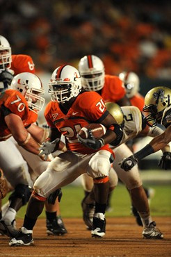 University of Miami Hurricanes running back, Derron Thomas #21, rushed 8 times for 35 yards, caught 1 pass for 19 yards, and scored 1 touchdown in a...