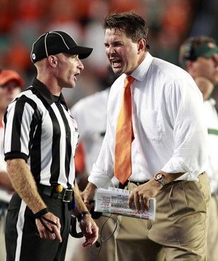 Miami head coach Al Golden argues with field judge Joel Clay during the second quarter of an NCAA college football game against the Ohio State,...