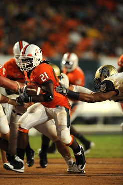 University of Miami Hurricanes running back, Derron Thomas #21, rushed 8 times for 35 yards, caught 1 pass for 19 yards, and scored 1 touchdown in a...