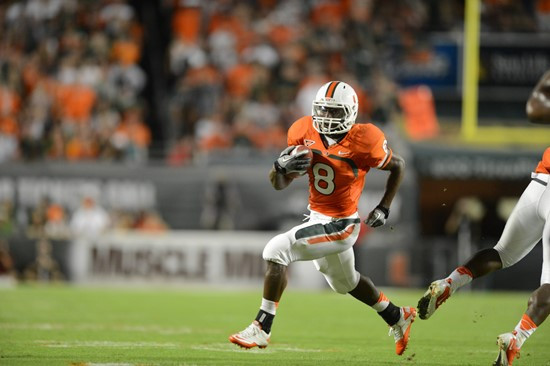 University of Miami Hurricanes running back Duke Johnson #8 catches a deflected pass in a game against the Florida State Seminoles at Sun Life Stadium...
