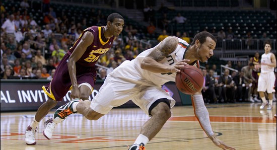 Miami's Trey McKinney Jones (4) steals the ball from Minnesota's Austin Hollins (20) during the first half of the second round of the  NIT tournament...