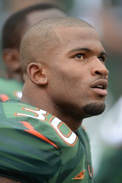 University of Miami Hurricanes running back De?Andre Johnson #30 plays in a game against the Arkansas State Red Wolves at Sun Life Stadium on...