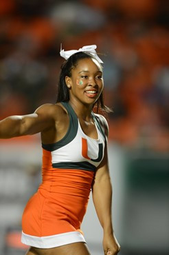 A University of Miami cheerleader shows her team spirit in a game against the Savannah State Tigers at Sun Life Stadium on September 21, 2013.  Photo...