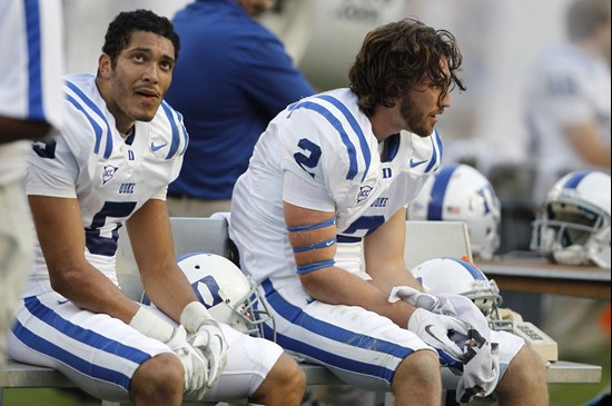 Duke wide receiver Brandon Braxton (5) and wide receiver Conner Vernon (2) sit on the sideline in the third quarter against Miami. (AP Photo/Lynne...
