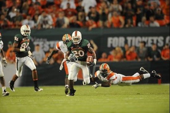 University of Miami Hurricanes running back Damien Berry #20 breaks tackles and makes a long run in a game against the Florida A&M Rattlers at Land...