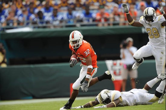 University of Miami Hurricanes running back Lee Chambers #32 plays in a game against the University of Central Florida Knights at Dolphin Stadium on...