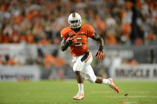 University of Miami Hurricanes running back Mike James #5 carries the ball against the Florida State Seminoles at Sun Life Stadium on October 20,...