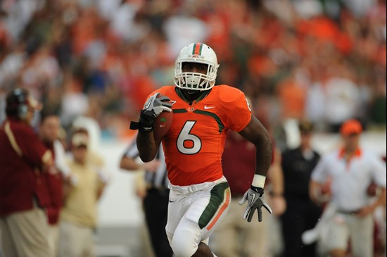 University of Miami Hurricanes running back Lamar Miller #6 carries the ball against the Boston College Eagles at Sun Life Stadium on November 25,...