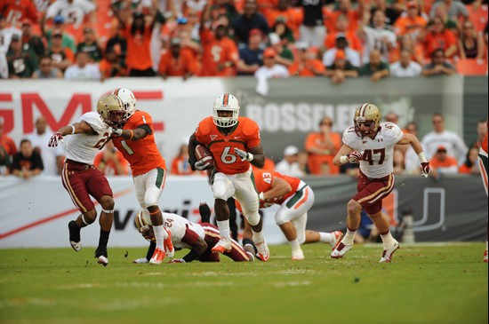 University of Miami Hurricanes running back Lamar Miller #6 carries the ball against the Boston College Eagles at Sun Life Stadium on November 25,...