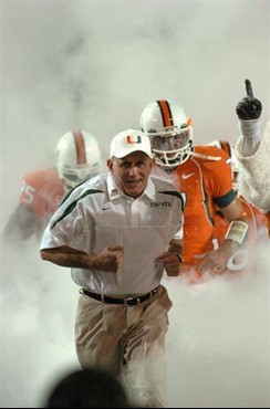 Universtiy of Miami Hurricanes head coach Larry Coker leads his team onto the field through a tunnel of smoke in a game against the Virginia Tech...