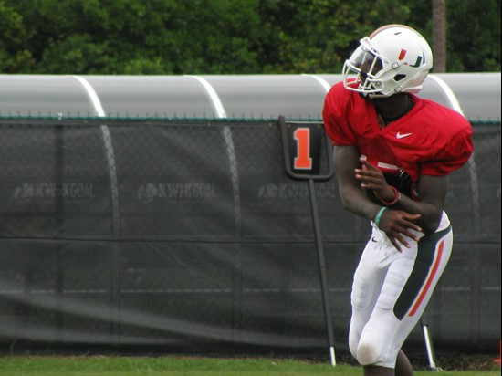 Senior quarterback Jacory Harris releases a pass during a drill for wide receivers on Thursday.