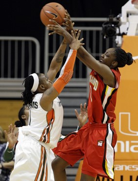 Maryland's Laurin Mincy (1) shoots over Miami's Riquna Williams (1). (AP Photo/Lynne Sladky)