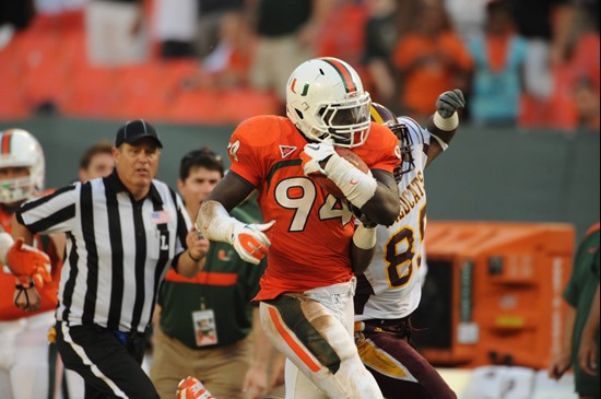 University of Miami Hurricanes linebacker Kelvin Cain #94 intercepts a pass and returns it for a touchdown in a game against the Bethune Cookman...