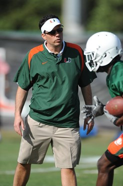 University of Miami Offensive Coordinator/Quarterbacks Coach, Jedd Fisch, instructs the team on how he wants them to execute his game plan during a...