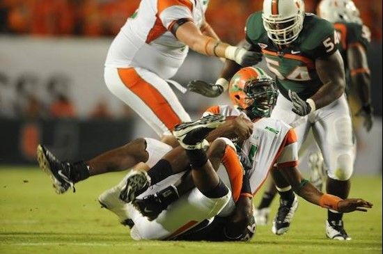 University of Miami Hurricanes defensive end Eric Moncur #94 makes a sack in a game against the Florida A&M Rattlers at Land Shark Stadium on October...
