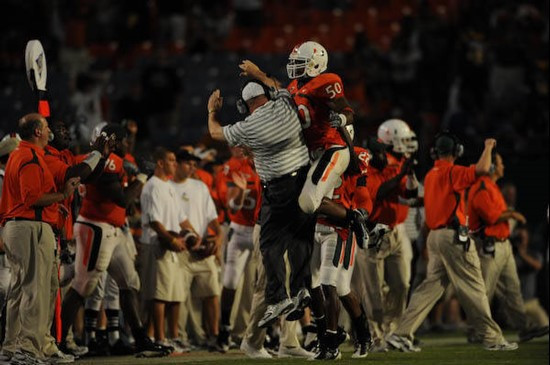 University of Miami Hurricanes linebacker Darryl Sharpton #50 celebrates with his team after stopping the University of Central Florida Knights on...