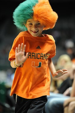 A fan cheers for The University of Miami Hurricanes as they play host to 2010 NCAA Final Four participant West Virginia at the BankUnited Center on...