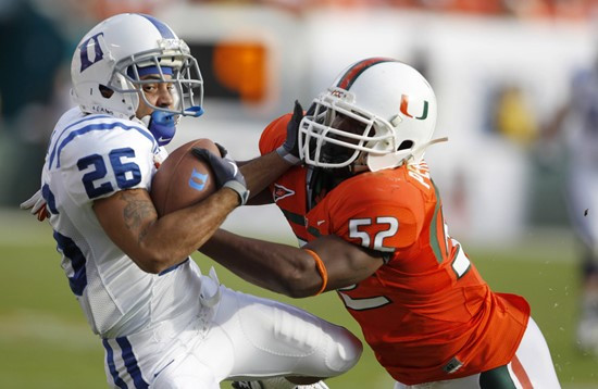 Miami linebacker Denzel Perryman (52) knocks down Duke wide receiver Donovan Varner. (AP Photo/Lynne Sladky)