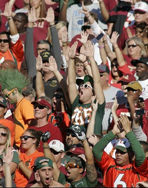 Miami fans cheer during the first quarter of an NCAA college football game against Florida State on Saturday, Nov. 12, 2011 in Tallahassee, Fla. (AP...