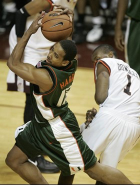 Miami's Anthony Harris (12) maintains possession of the ball after colliding with Virginia Tech's Zabian Dowdell (1) during the first half action of a...