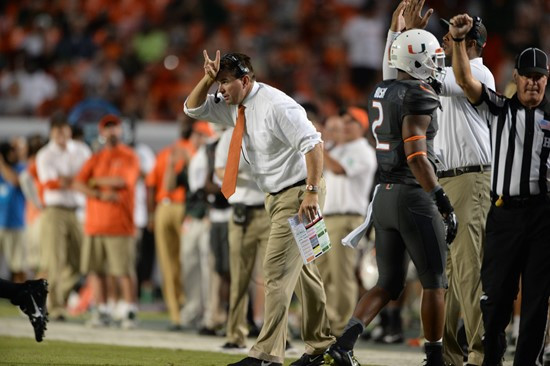 University of Miami Hurricanes head coach Al Golden calls in a play in a game against the Duke Blue Devils at Sun Life Stadium on September 27, 2014. ...