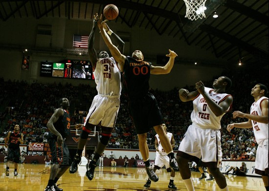 Virginia Tech's Cheick Diakite battles for a rebound with Jimmy Graham during second half action. Miami defeated Virginia Tech 74-71. (AP Photo/The...