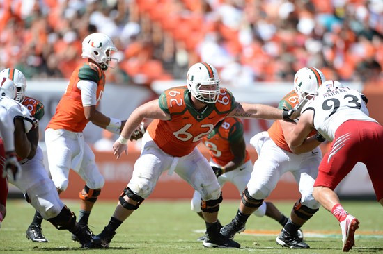 University of Miami Hurricanes offensive lineman Shane McDermott #62 plays in a game against the Cincinnati Bearcats at Sun Life Stadium on October...